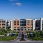 Modern hospital building exterior representing top healthcare facilities and medical job opportunities